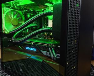 A computer case with a window on the side lit with LED lights displaying the graphics card