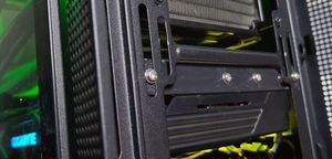 Case with front panel removed showing the custom bracket bolted to the front of the card and the case